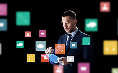 Image showing businessman with tablet pc and virtual menu icons