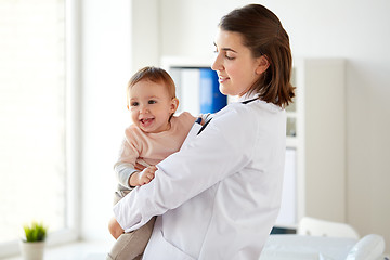 Image showing doctor or pediatrician holding baby at clinic