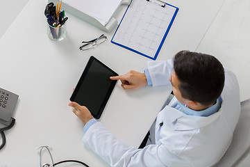 Image showing doctor with tablet pc and cardiogram at clinic