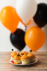 Image showing halloween party decorated cupcakes on plate