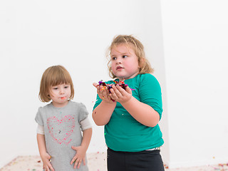 Image showing kids  blowing confetti