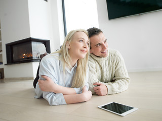 Image showing Young Couple using digital tablet on cold winter day