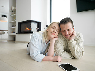 Image showing Young Couple using digital tablet on cold winter day