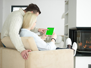 Image showing Couple using digital tablet on cold winter day