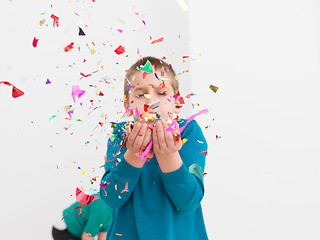 Image showing kids  blowing confetti