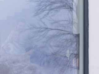 Image showing Couple using digital tablet on cold winter day