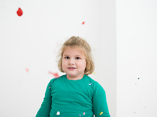 Image showing kid blowing confetti