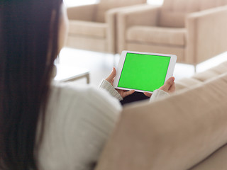 Image showing asian woman using Digital Tablet on sofa