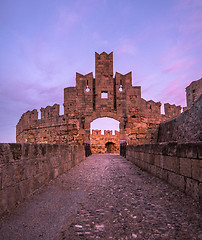 Image showing The fortress wall in the harbor at sunset. Rhodes