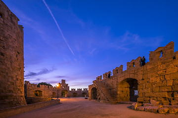 Image showing The fortress wall in the harbor at sunset. Rhodes