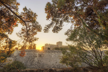 Image showing The fortress wall in the harbor at sunset. Rhodes