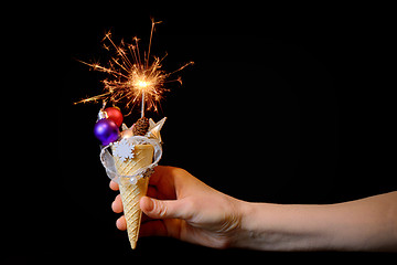 Image showing Ice cream cone and christmas decoration