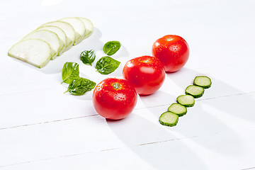 Image showing The fresh tomatos on white background