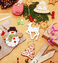 Image showing lot of stuff for handmade gifts, scissors, ribbon, paper with countryside pattern, ready for holiday concept, nobody home 