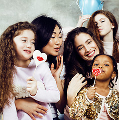 Image showing Lifestyle and people concept: young pretty diversity nations woman with different age children celebrating on birth day party together happy smiling, making selfie. African-american, asian and caucasi