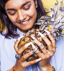 Image showing lifestyle people concept. young pretty smiling indian girl with long nails wearing lot of jewelry rings, asian summer happy cool 