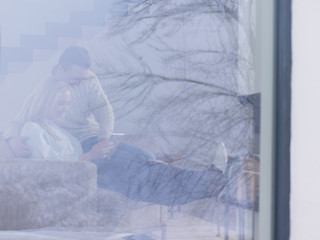 Image showing Couple using digital tablet on cold winter day