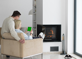 Image showing Couple using digital tablet on cold winter day