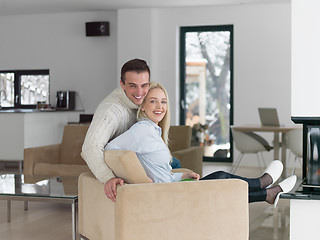 Image showing Couple using digital tablet on cold winter day