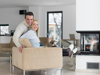 Image showing Couple using digital tablet on cold winter day