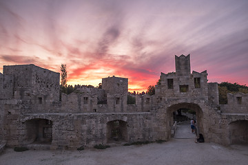 Image showing The fortress wall in the harbor at sunset. Rhodes