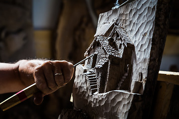 Image showing Sculptor hands working wood