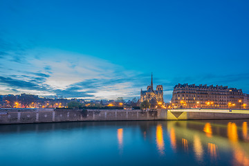 Image showing Notre Dame Cathedral with Paris cityscape at dus