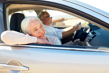 Image showing happy senior couple driving in car