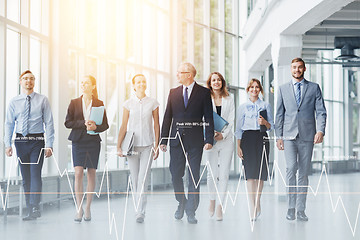 Image showing business people walking along office building