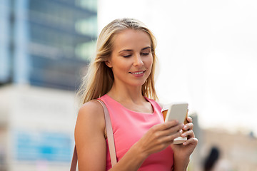 Image showing woman with coffee and smartphone in city