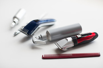 Image showing styling hair sprays, clippers, comb and scissors