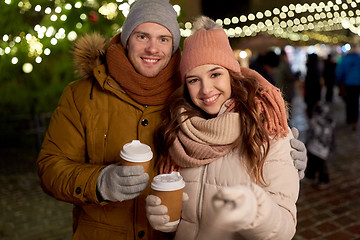 Image showing couple with coffee taking selfie at christmas