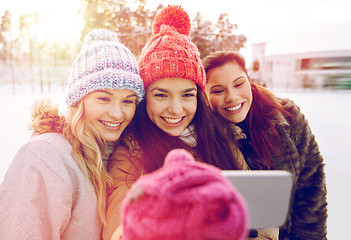 Image showing happy teenage girls taking selfie with smartphone