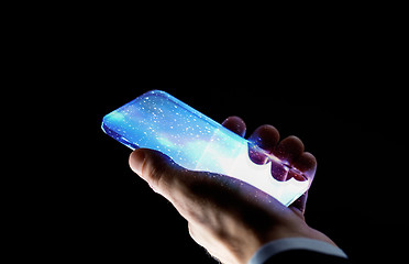 Image showing close up of hand with space on smartphone screen