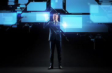 Image showing businessman working with virtual screen