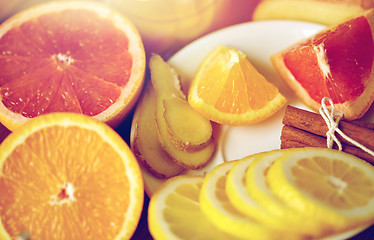 Image showing honey, citrus fruits, ginger and cinnamon