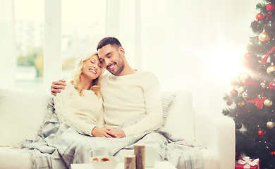 Image showing happy couple at home with christmas tree