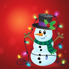 Image showing Snowman with Christmas lights image 3