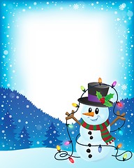 Image showing Snowman with Christmas lights frame 1