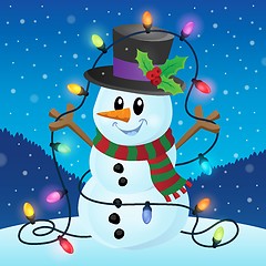 Image showing Snowman with Christmas lights image 2