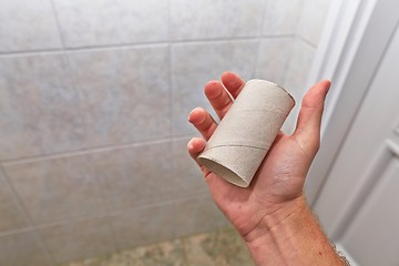 Image showing Finding empty roll in the restroom