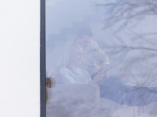 Image showing Couple using digital tablet on cold winter day