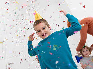 Image showing kids  blowing confetti