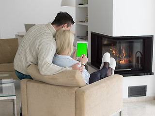 Image showing Couple using digital tablet on cold winter day