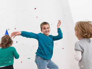 Image showing kids  blowing confetti