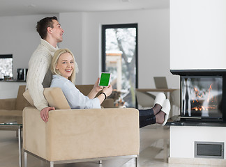 Image showing Couple using digital tablet on cold winter day