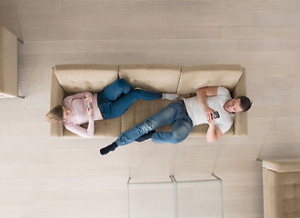 Image showing couple on sofa using mobile phones top view