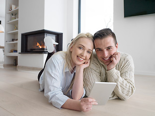 Image showing Young Couple using digital tablet on cold winter day