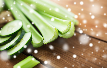 Image showing close up of celery stems and sliced cucumber