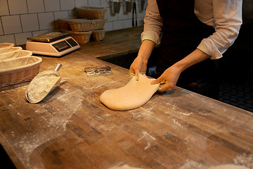 Image showing chef or baker cooking dough at bakery